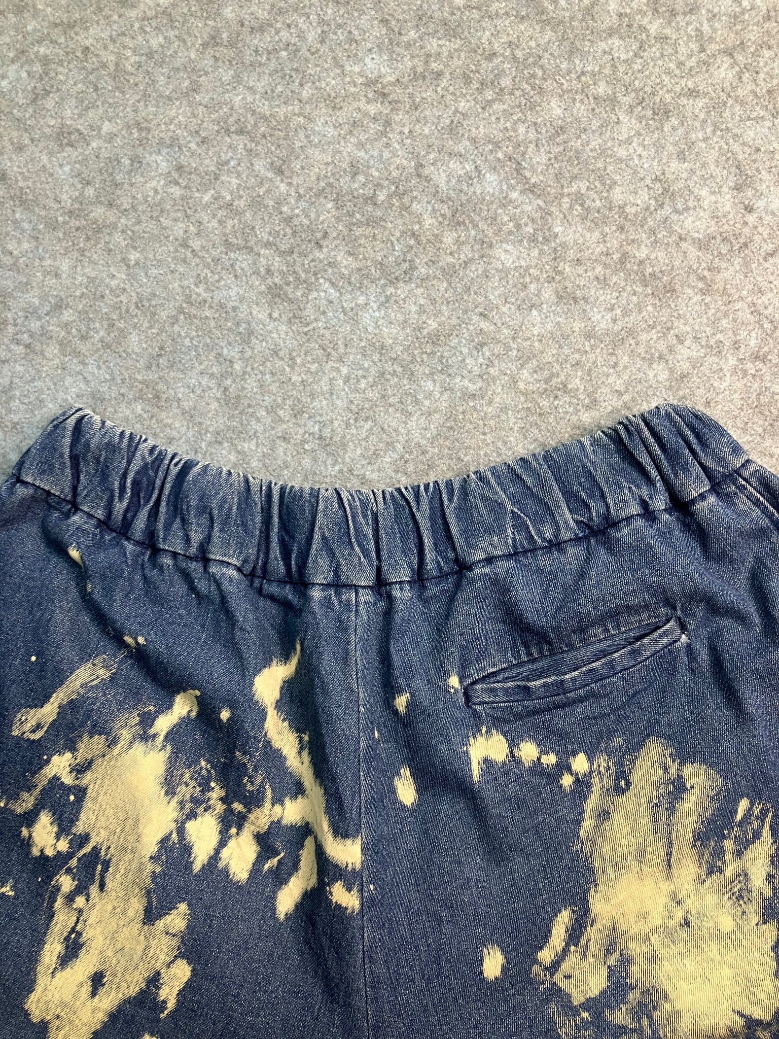 blue paint-stain balloon jeans