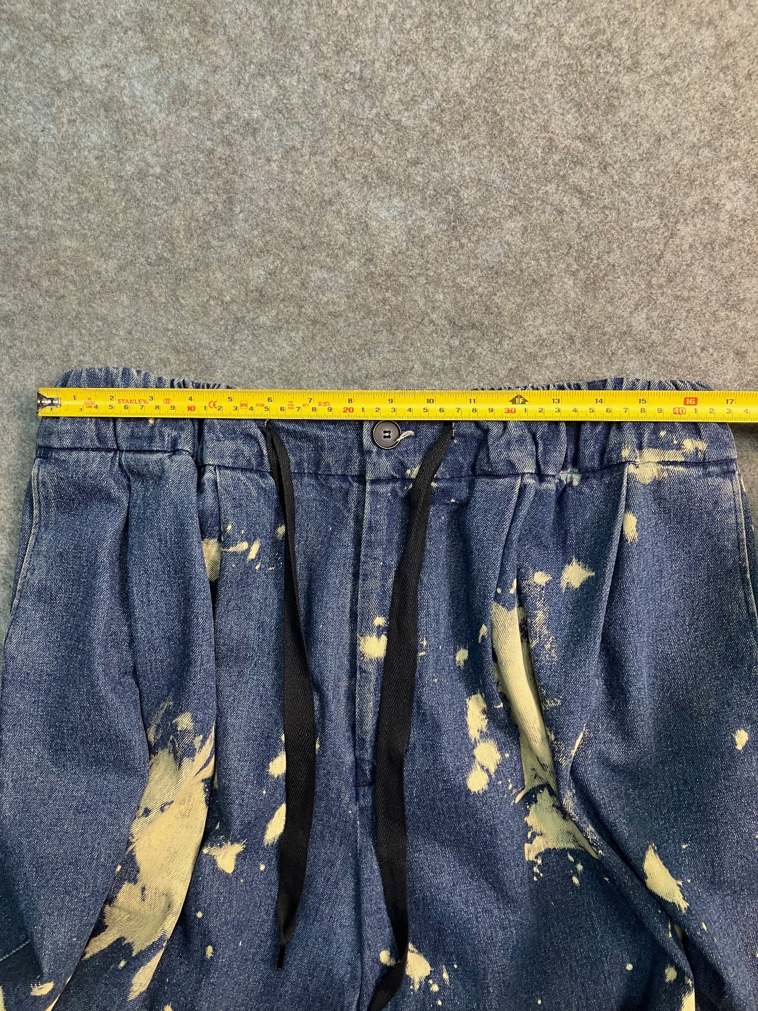 blue paint-stain balloon jeans