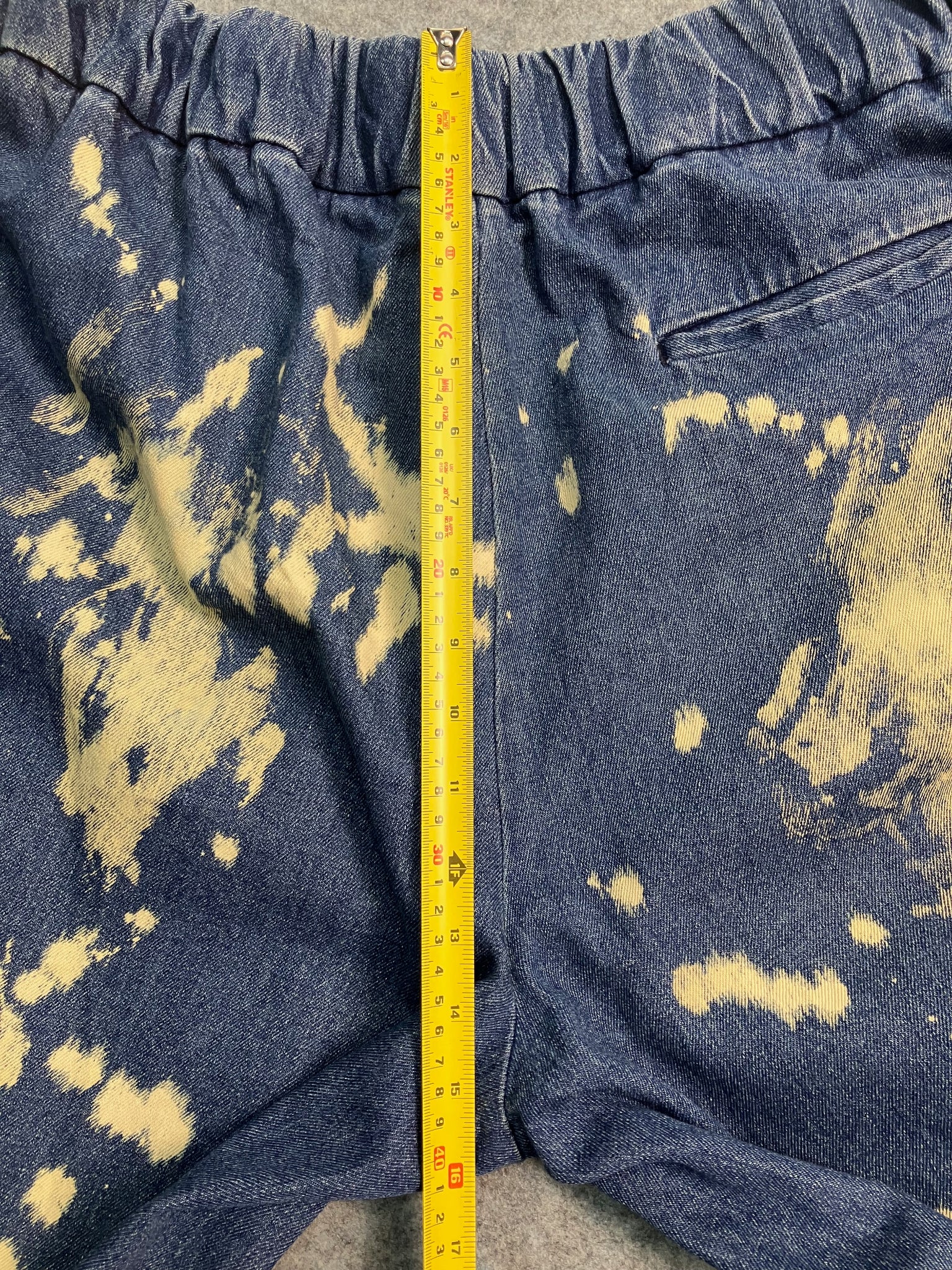 blue paint-stain balloon jeans