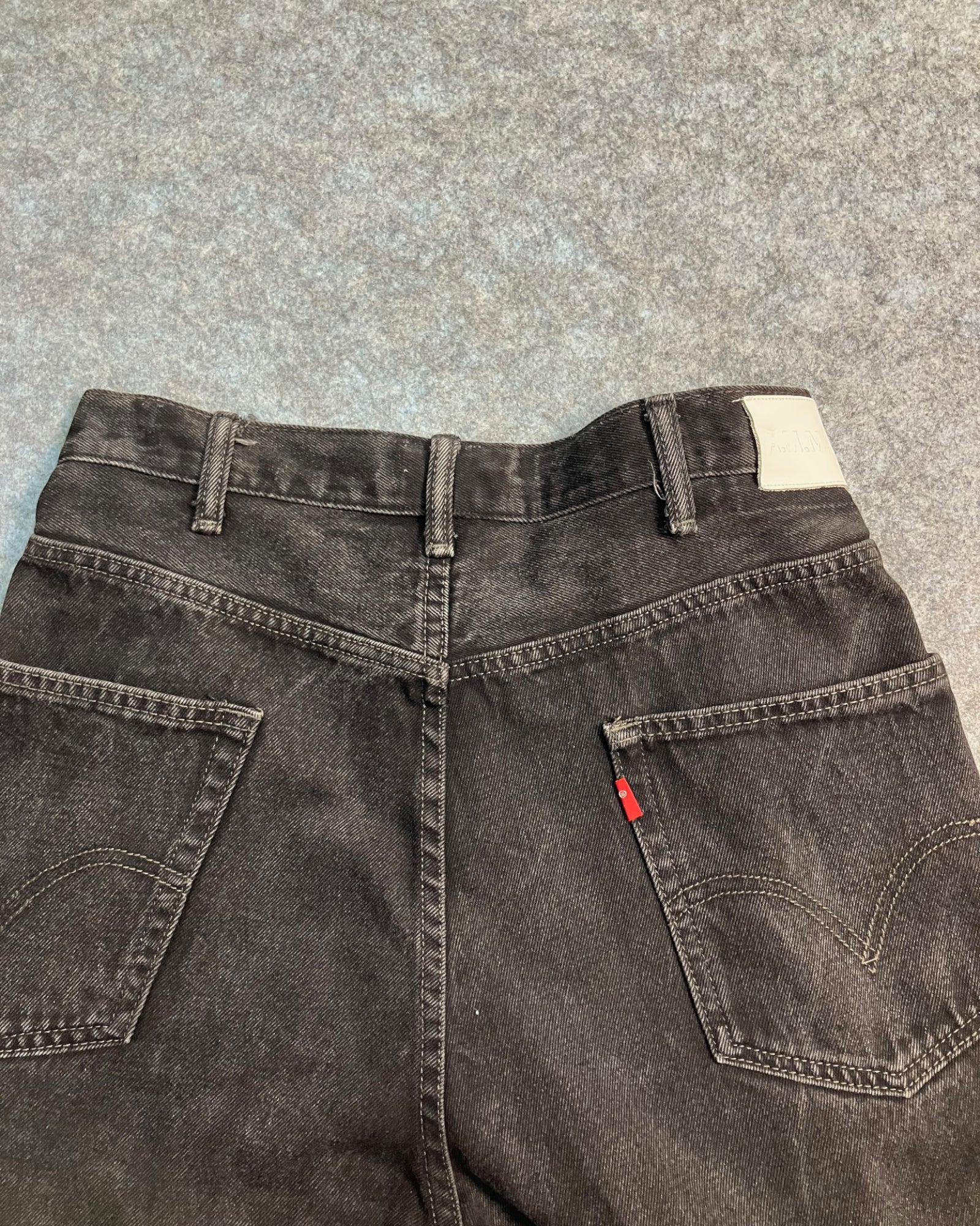 black reworked regular-fit jeans