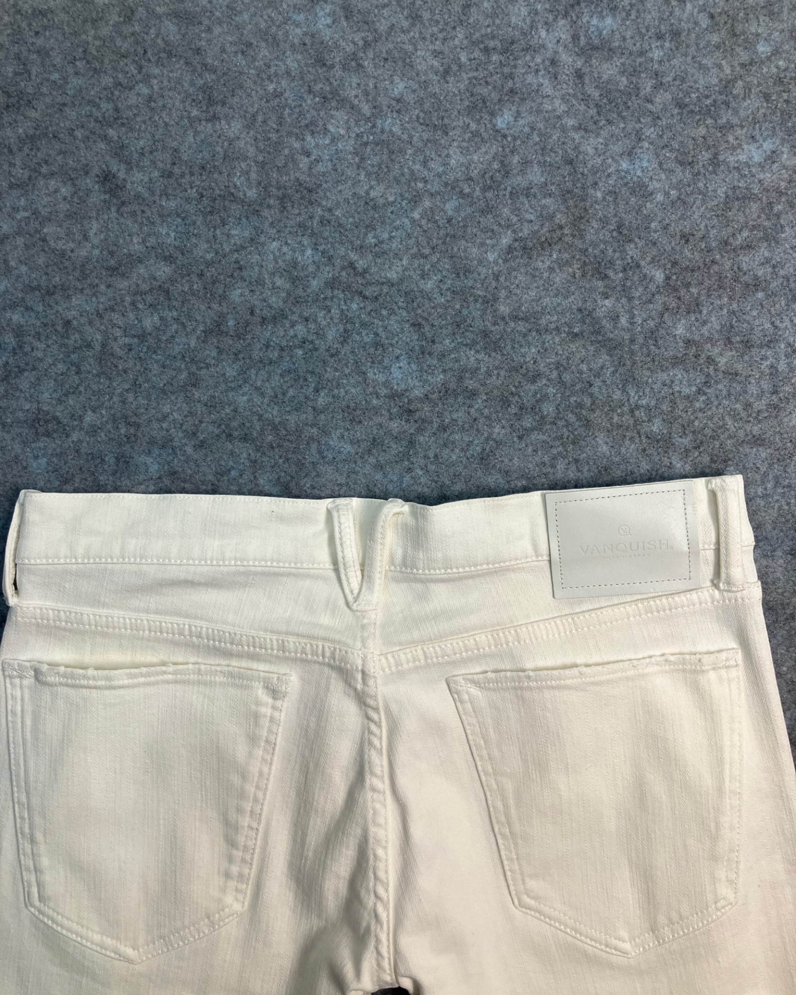 white distressed slim-fit jeans