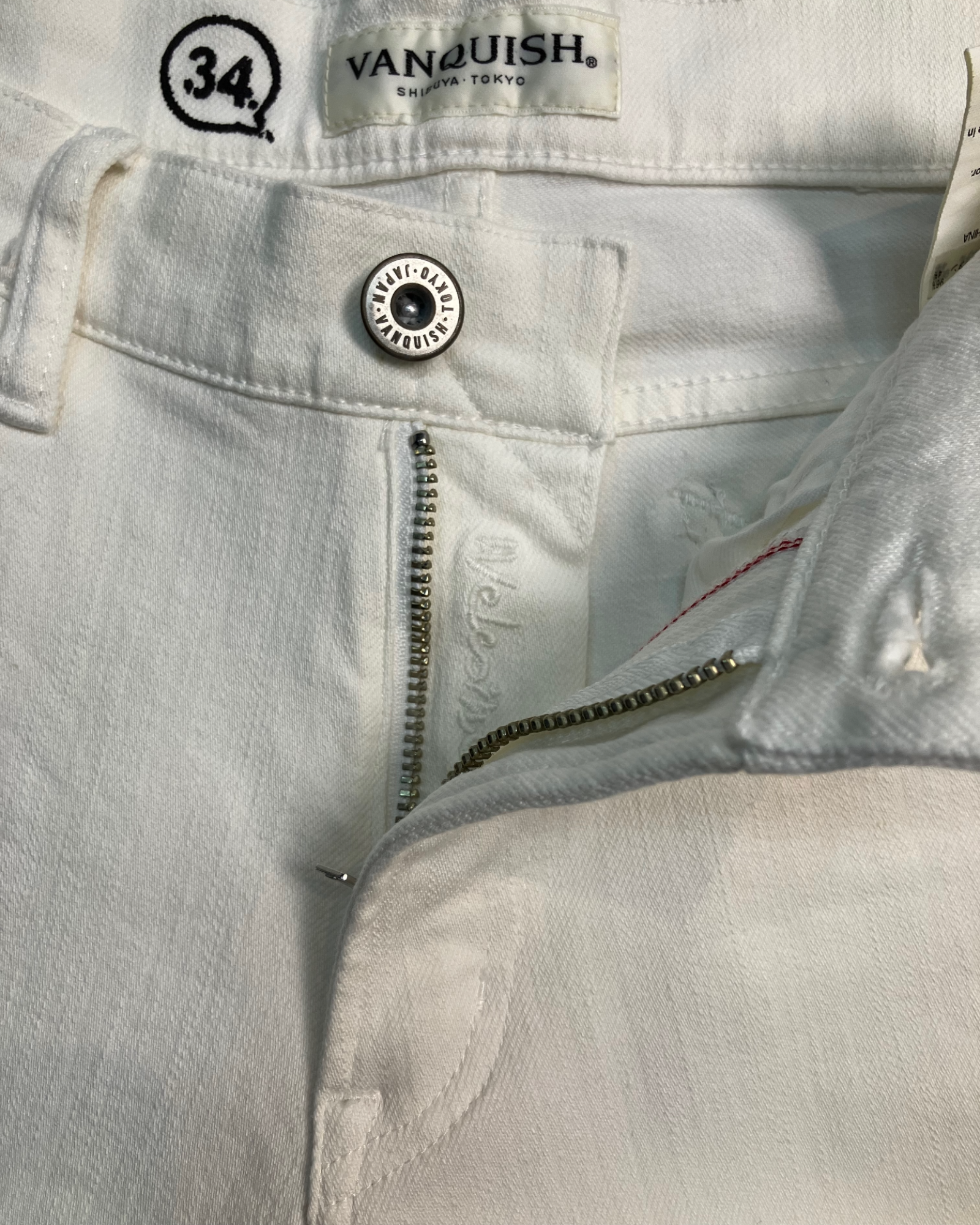 white distressed slim-fit jeans