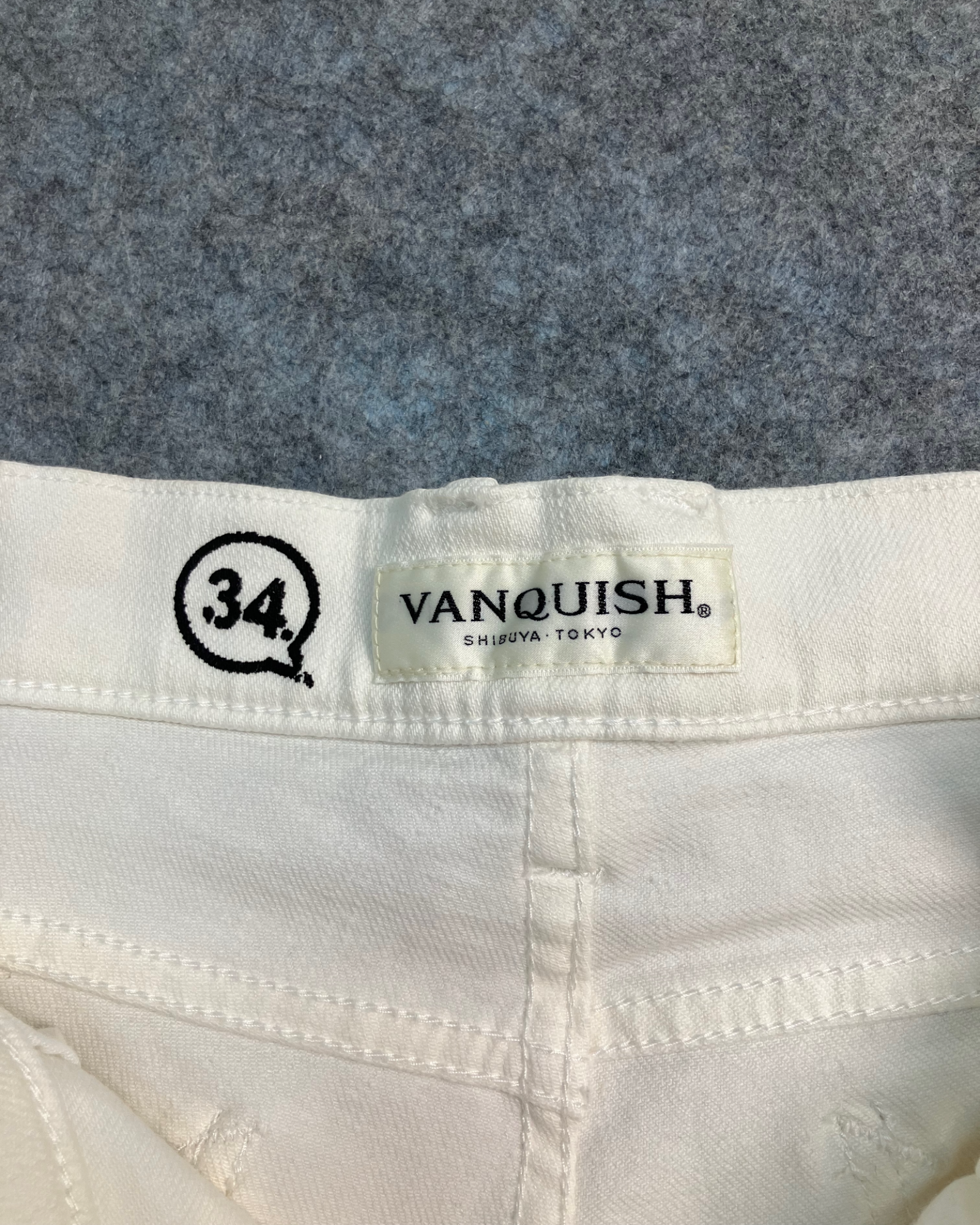 white distressed slim-fit jeans