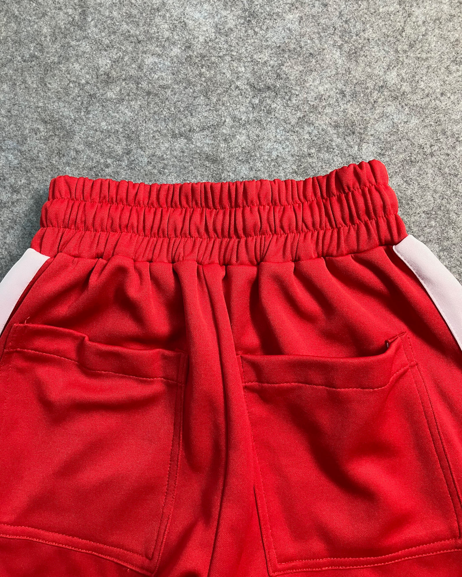 red slim-fit sweat pants