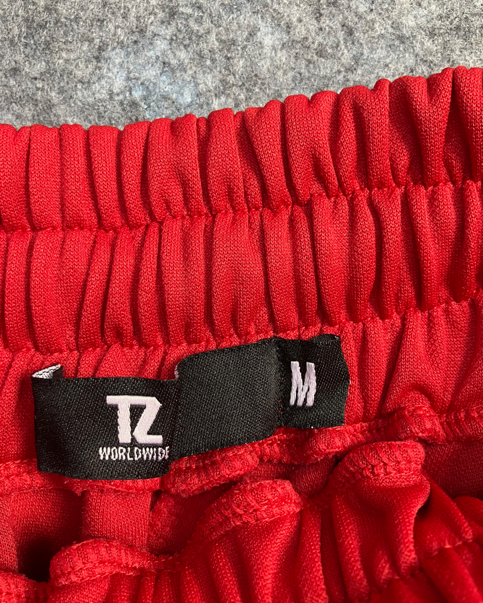 red slim-fit sweat pants