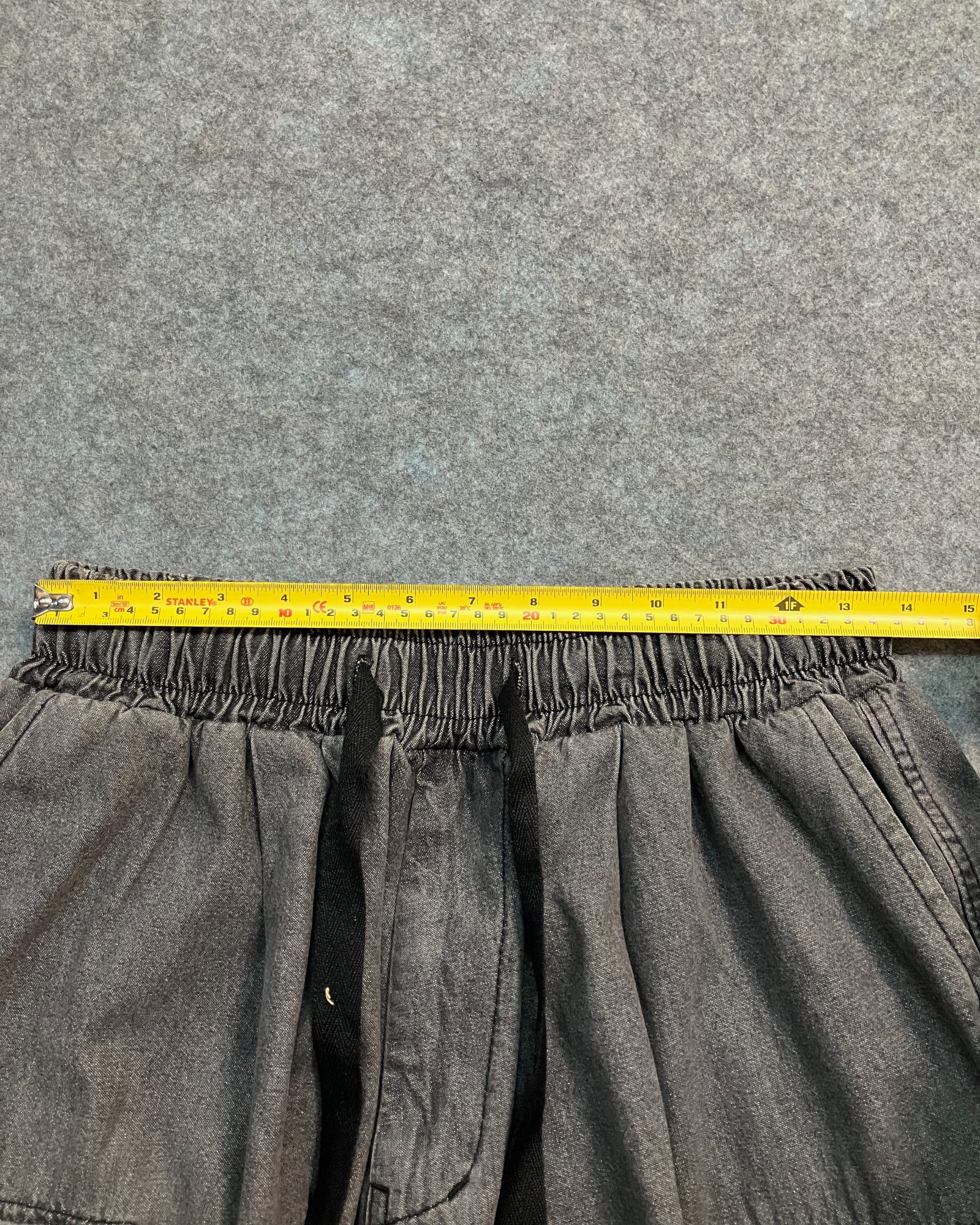 black cargo distressed shorts